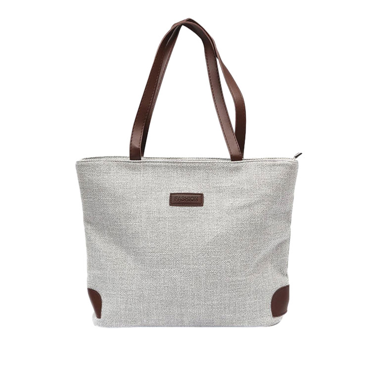 What are the material characteristics of the canvas tote bag?